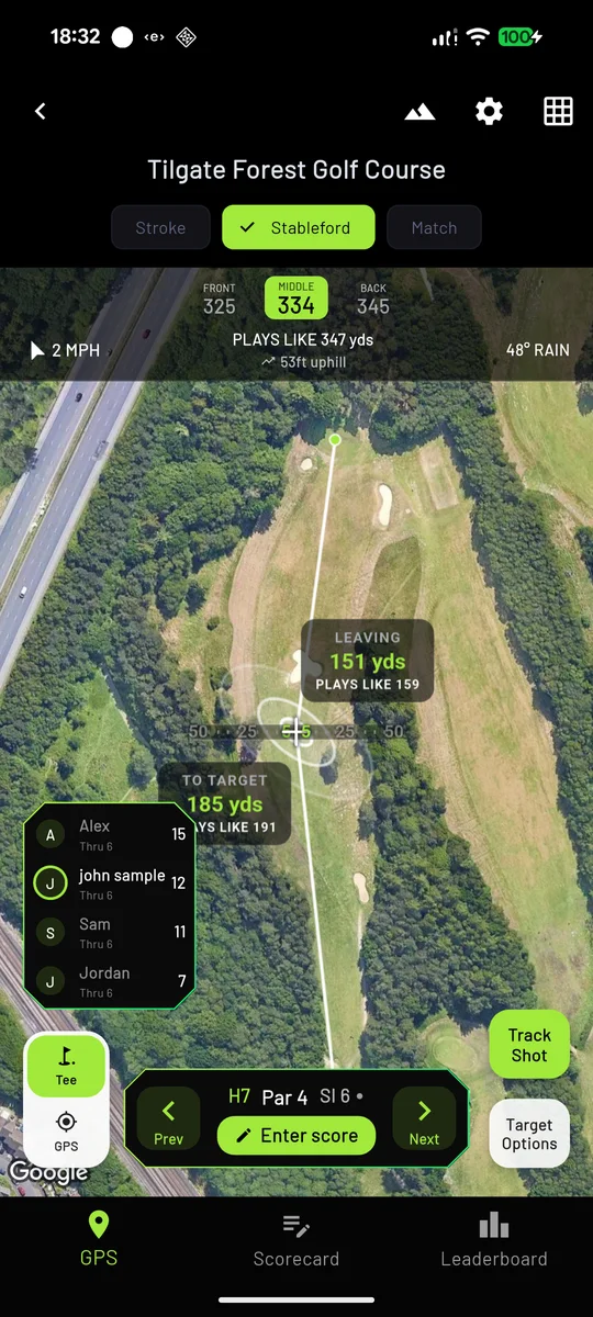 PureGolfAI GPS screen showing hole 7 with front, middle and back distances, plays-like yardage, wind, and a live Stableford mini leaderboard